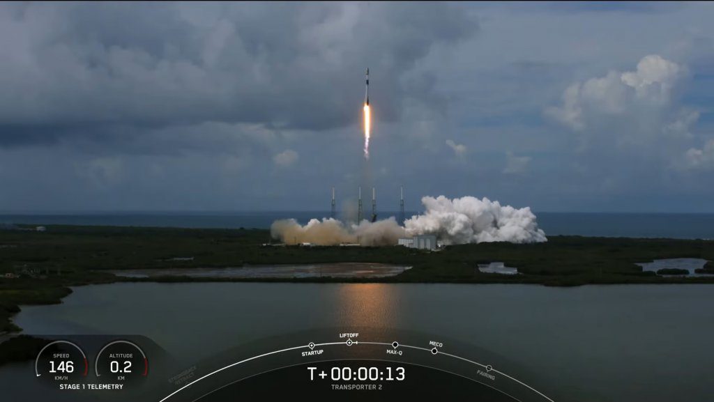 The Falcon 9 rocket lifting-off carrying its multiple payloads into orbit